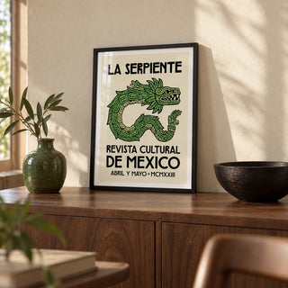 Serpent Cultural Art Print, a small A4 framed print leaning on a walnut sideboard in a living room