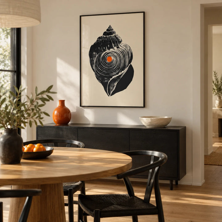 Shankha Art Print, framed on the wall of a compact modern dining room with warm white walls and a round oak table with black wooden chairs