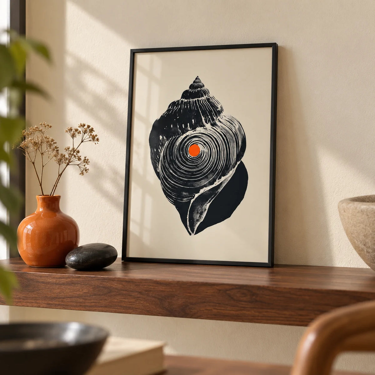 Shankha Art Print, a small A4 framed print leaning on a walnut shelf in a living room