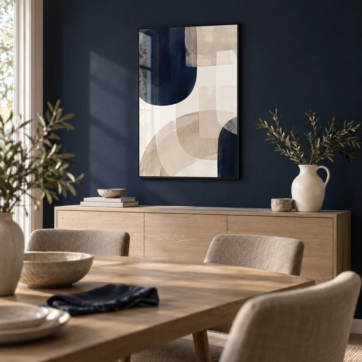 Shapes Minimalist Print, framed on the wall of a modern dining room with a deep navy painted wall