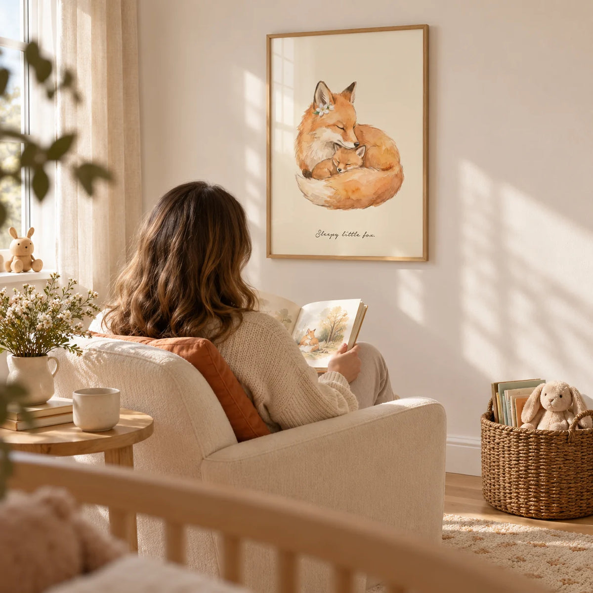Sleepy Fox Art Print, framed on the wall of a quiet nursery reading corner with a warm white wall and light oak flooring