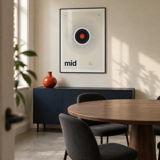 Speaker Poster, framed on the wall of a compact modern dining room in a UK terraced house with cream walls and a plain concrete floor