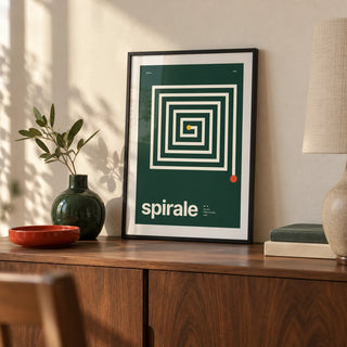 Spiral Print, a small A4 framed print leaning on a walnut sideboard in a living room