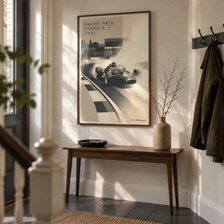 Sports Car Poster, framed on the wall of a characterful entrance hallway in a motorsport enthusiast's UK terraced house with cream plaster walls and dark grey floorboards