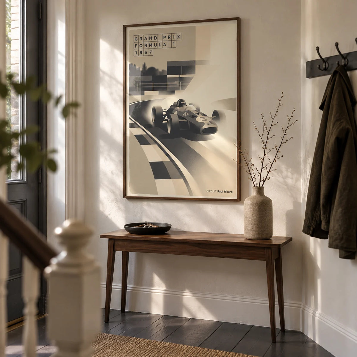 Sports Car Poster, framed on the wall of a characterful entrance hallway in a motorsport enthusiast's UK terraced house with cream plaster walls and dark grey floorboards