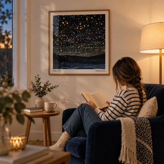 Starry Night Print, framed on the wall of a cosy evening reading corner with a cream wall in a living room