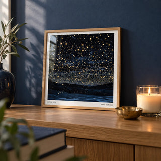 Starry Night Print, a small A4 framed print leaning on an oak shelf in a living room