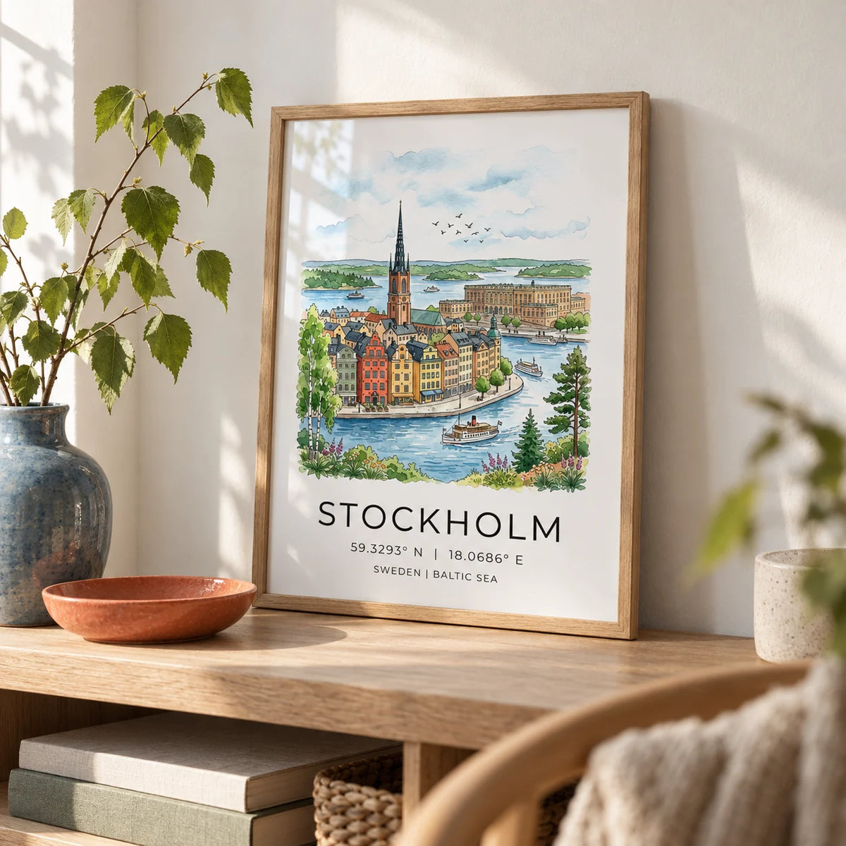 Stockholm City Art Print, a small A4 framed print leaning on a pale oak shelf in a living room