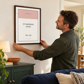 Street Name Poster in a placing the print at home, dark wood frame