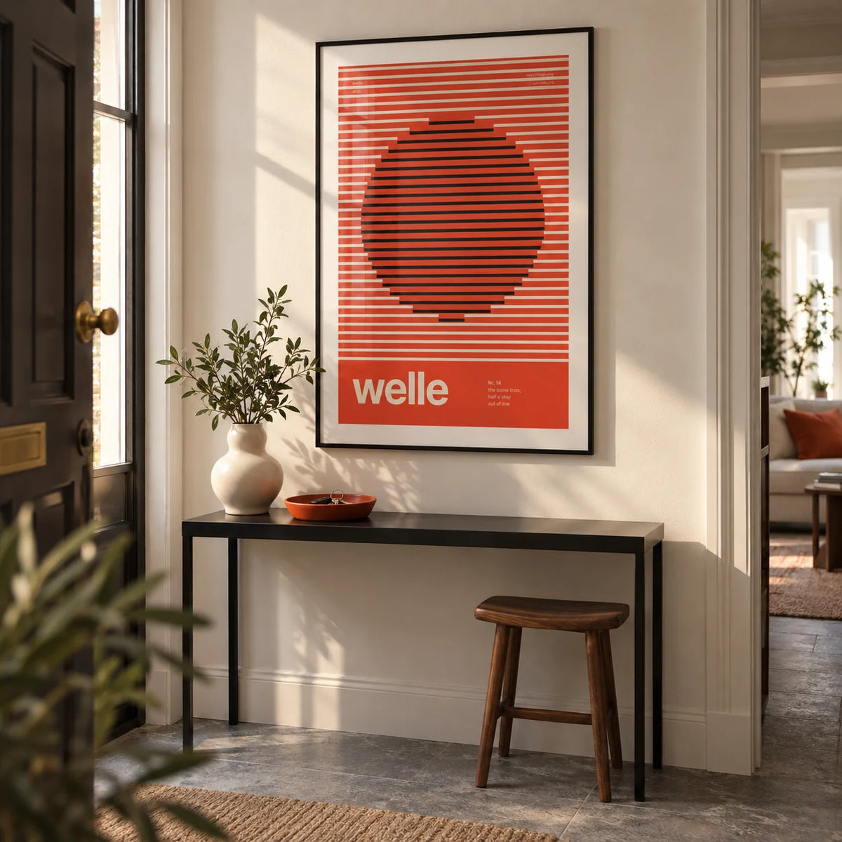 Stripe Print, framed on the wall of a design-led entrance hallway in a UK flat with a warm white wall and grey stone flooring