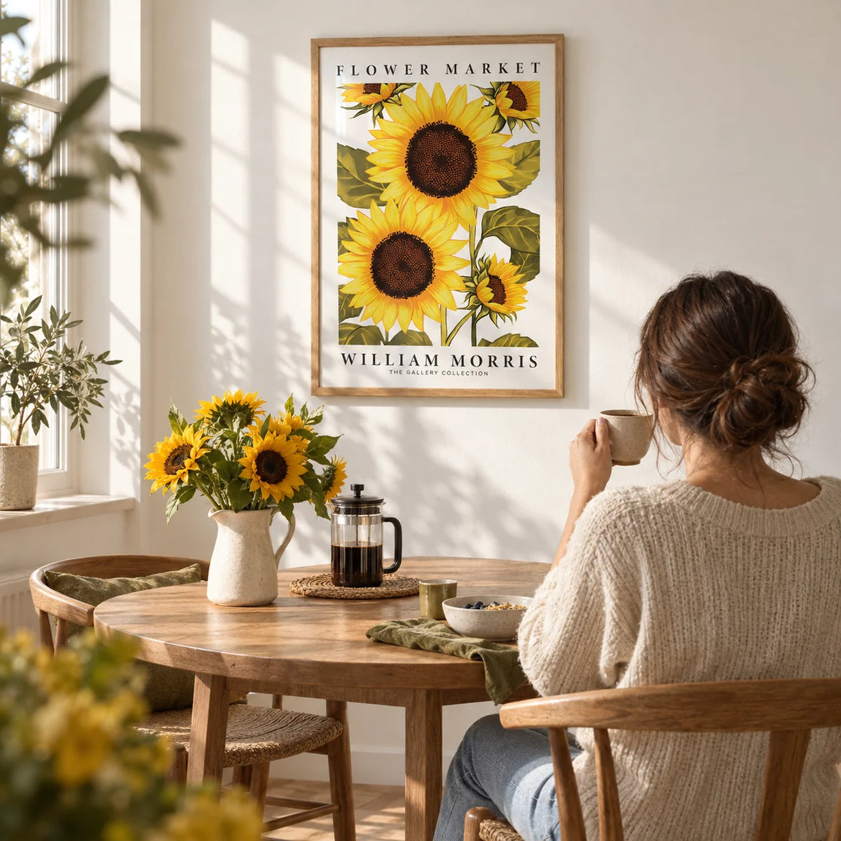 Sunflower Wall Art, framed on the wall of a sunny breakfast nook with a white wall in a kitchen