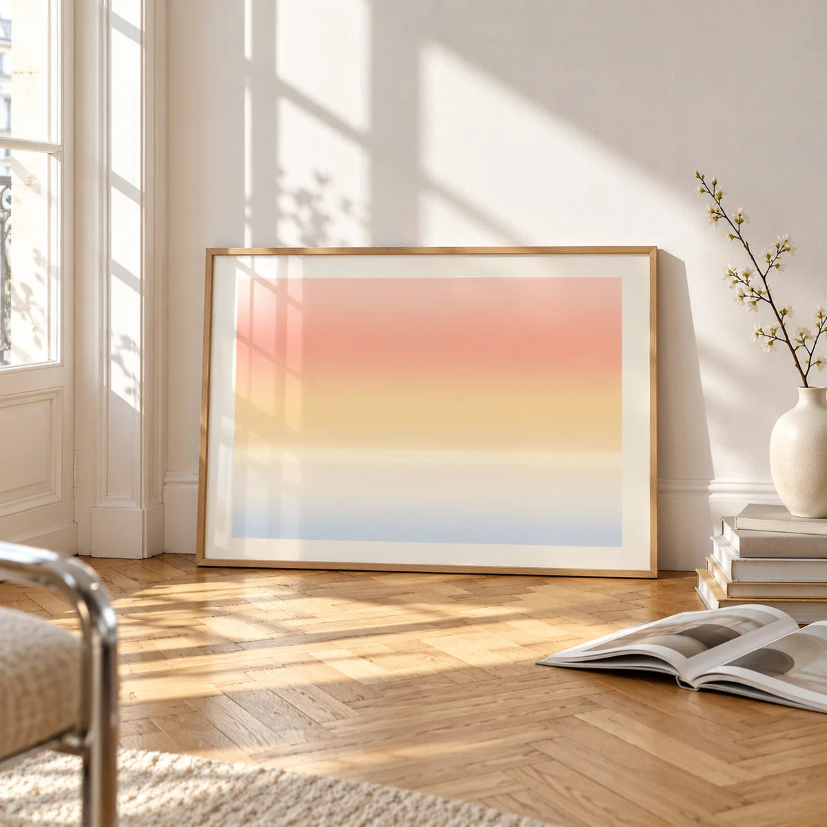 Sunrise Wall Art, framed and leaning on the parquet floor of a bright living room