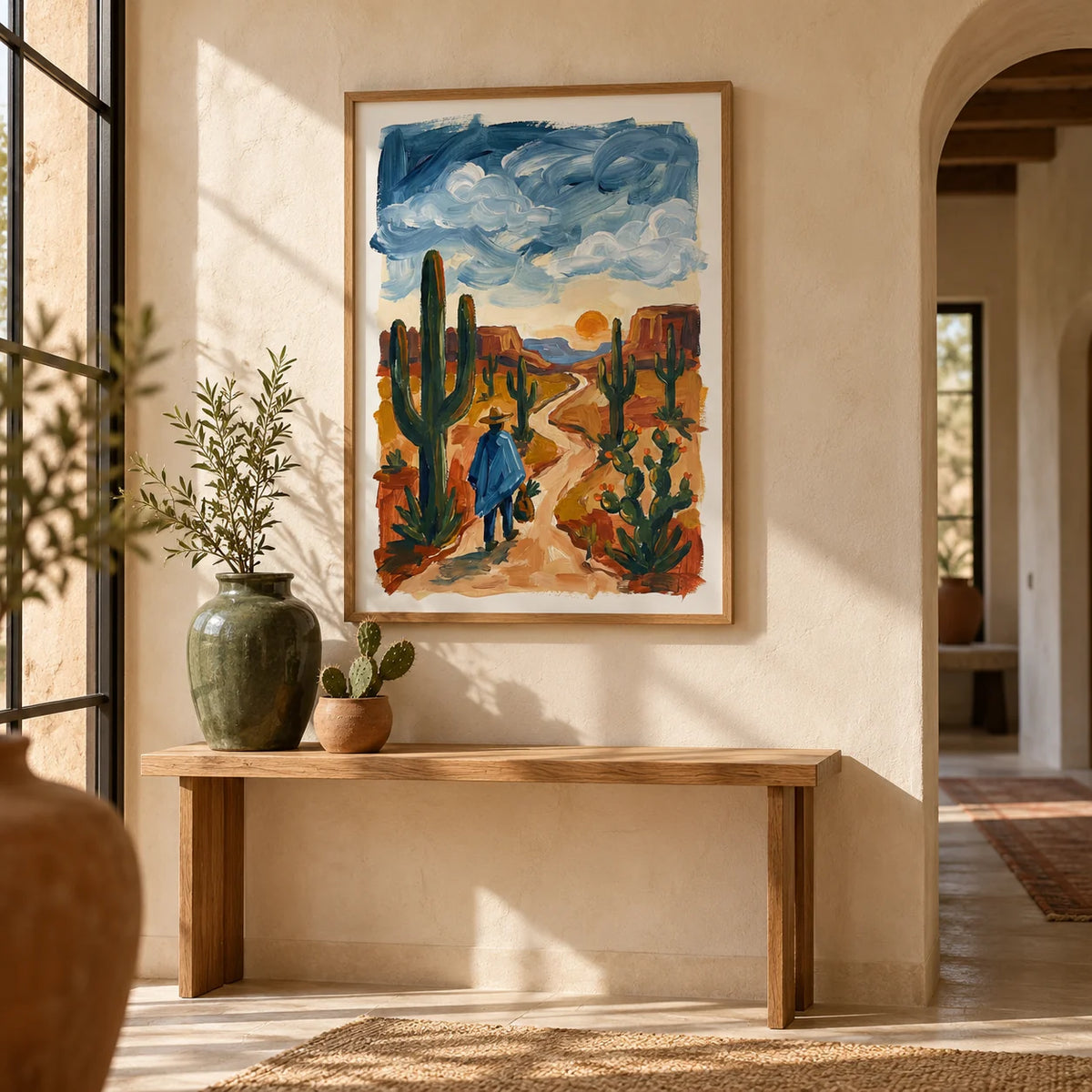 Sunset Cactus Poster Print, framed on the wall of a desert-modern hallway with an arched doorway and limewashed walls