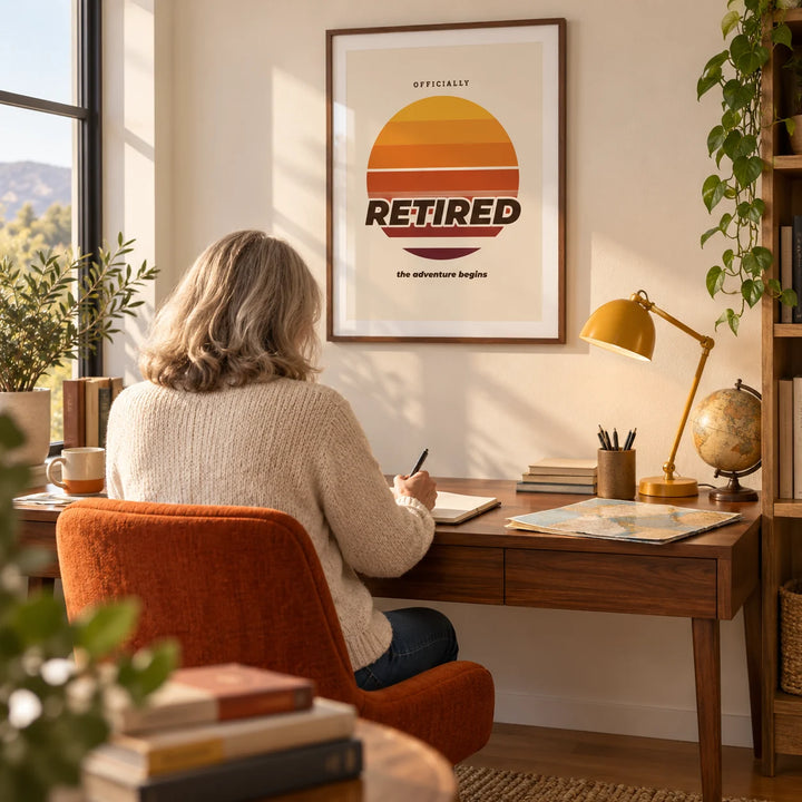 Sunset Poster, framed on the wall of a bright home study for a recently retired adult (55-75) with an ivory wall and an oak floor
