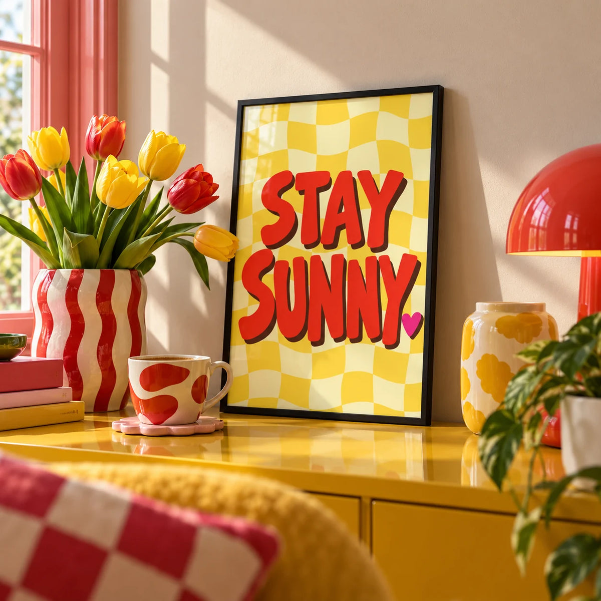 Sunshine Print, a small A4 framed print leaning on a colourful lacquered shelf in a living room