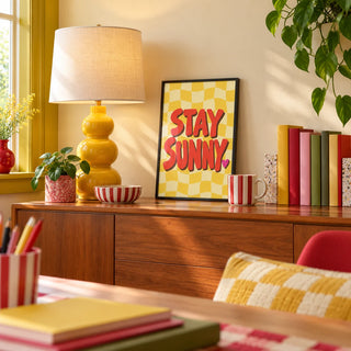 Sunshine Print, a small A4 framed print leaning on a desk