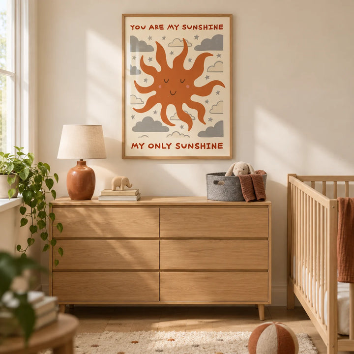 Sunshine Quote Wall Art, framed on the wall of a warm modern nursery in a UK terraced family home with cream walls and pale oak floorboards