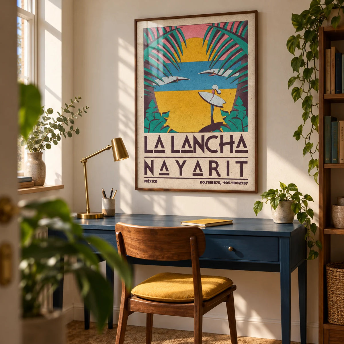 Surfer Beach Art Print, framed on the wall of a compact home study in a UK flat with warm white walls and a blue painted desk