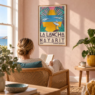 Surfer Beach Art Print, framed on the wall of a sunny reading corner in a UK coastal home with pale pink plaster walls in a living room