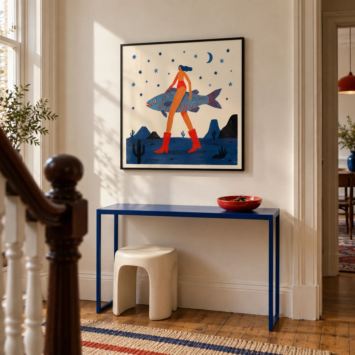 Surrealist Fish Art Print, framed on the wall of a design-led hallway in a Victorian UK terrace with warm white plaster walls and simple oak floorboards