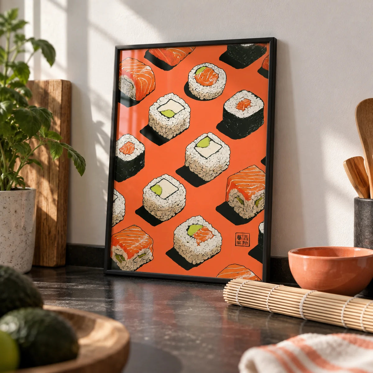 Sushi Wall, a small A4 framed print leaning on a black kitchen worktop