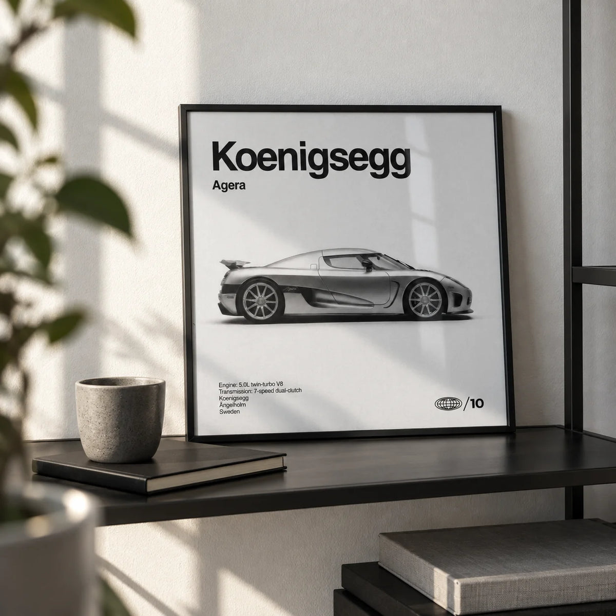 Swedish Hypercar Poster, a small A4 framed print leaning on a black metal shelf in a living room