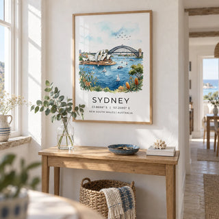 Sydney Watercolor Art Print, framed on the wall of a bright hallway in a UK coastal cottage with chalk-white plaster walls and pale stone flooring