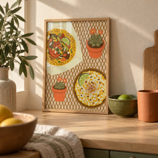 Taco Wall Art, a small A4 framed print leaning on a pale oak kitchen worktop
