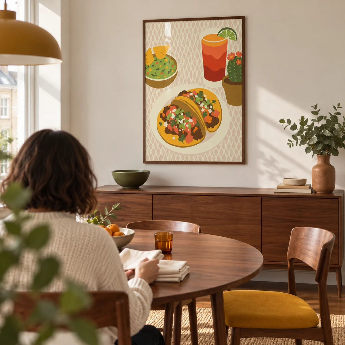 Tacos Art Print, framed on the wall of a contemporary dining room in a UK flat with a warm white wall and walnut furniture