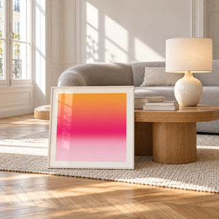 Tangerine Poster, framed and leaning against a coffee table in a bright living room