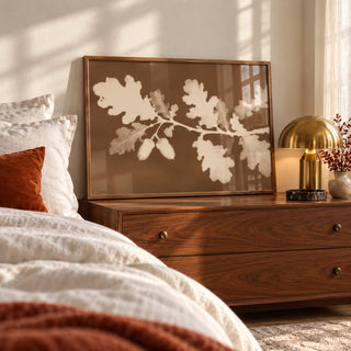 Tea Toned Oak Leaves Print styled leaning by a bed (frame not included)