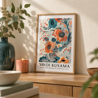 Teal and Orange Wall Art, a small A4 framed print leaning on an oak shelf in a living room