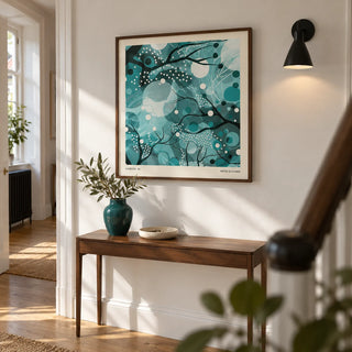 Teal Home Decor, framed on the wall of a bright hallway in a renovated UK terraced house with chalk white walls and plain oak floorboards