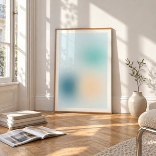 Teal Wall Art, framed and leaning on the parquet floor of a bright living room