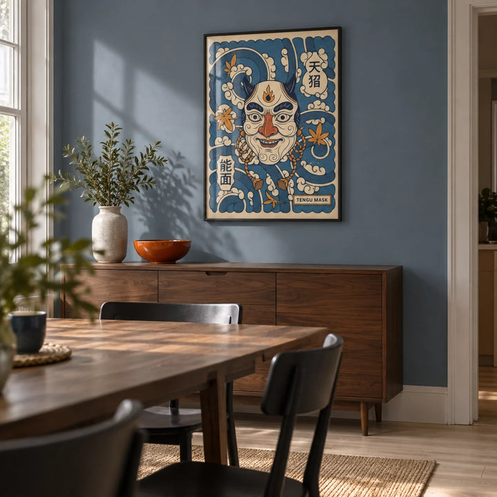Tengu Mask Art, framed on the wall of a compact contemporary dining room in a terraced house with muted blue walls and pale timber flooring