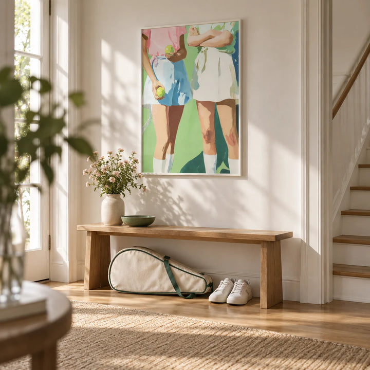 Tennis Girls Art Print, framed on the wall of a bright hallway