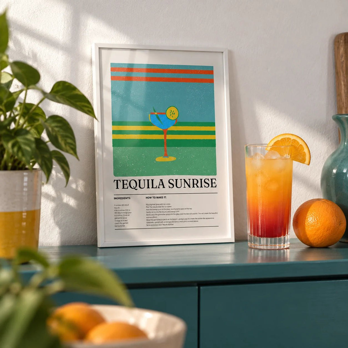 Tequila Wall Art, a small A4 framed print leaning on a teal painted shelf in a living room