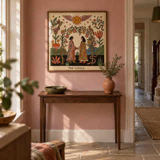 The Lovers Tarot Card Art, framed on the wall of a welcoming hallway in a modest UK period home with dusty pink painted walls and plain stone flooring