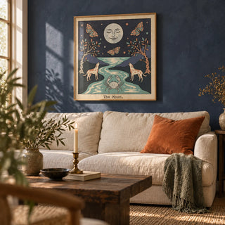 The Moon Tarot Card Art, framed on the wall of a warm living room with a navy limewashed wall