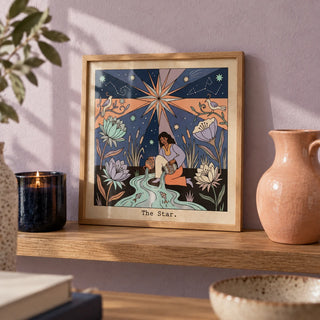 The Star Tarot Card Art, a small A4 framed print leaning on an oak shelf in a living room