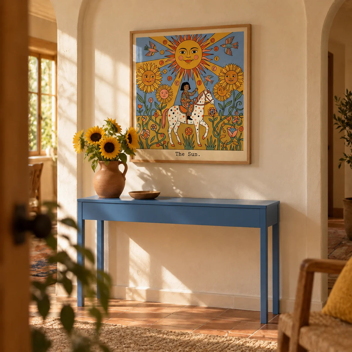 The Sun Tarot Card Art, framed on the wall of a warm hallway with an arched plaster niche