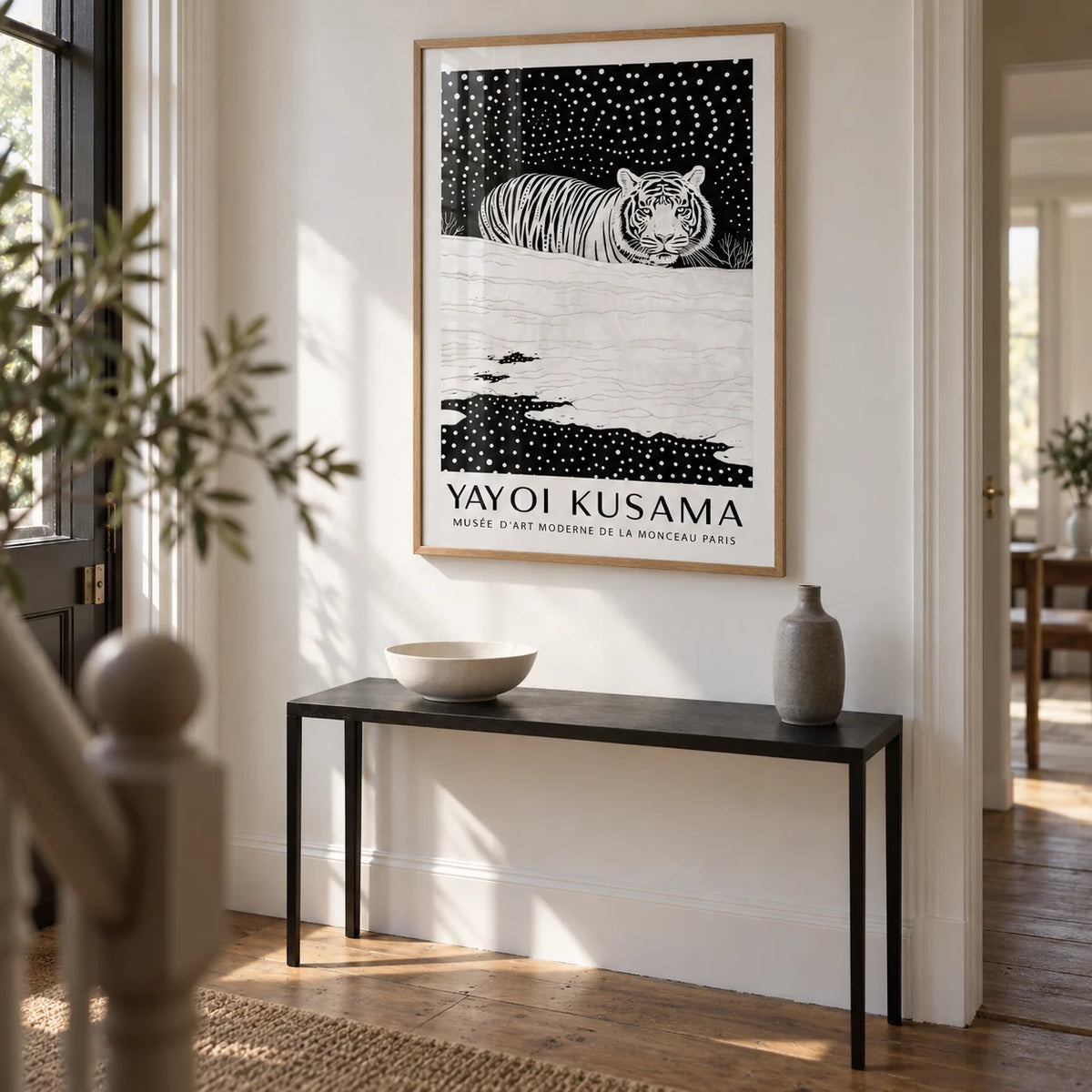 Snow Tiger Print, framed on the wall of a bright entrance hallway in a renovated UK terrace with a white wall and warm timber floorboards