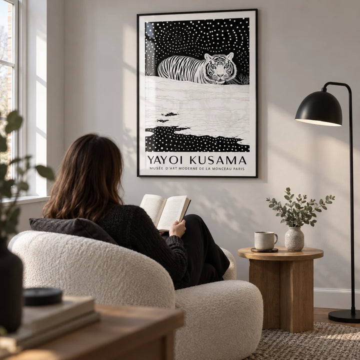 Snow Tiger Print, framed on the wall of a quiet reading corner in a modern UK home with a pale grey wall in a living room