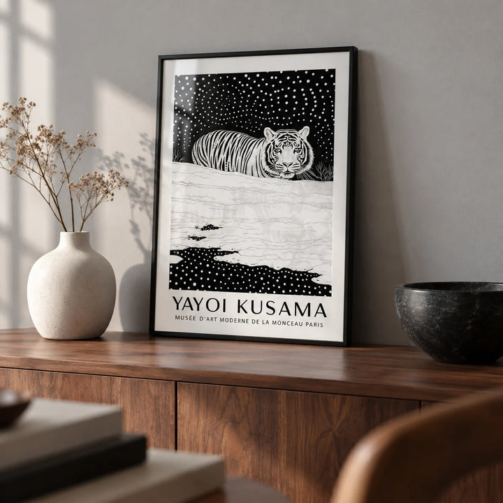Snow Tiger Print, a small A4 framed print leaning on a walnut sideboard in a living room