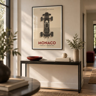 Top-Down Racing Car Poster, framed on the wall of a modern hallway with a warm white wall