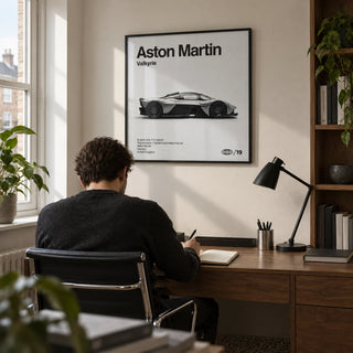 Track Hypercar Poster, framed on the wall of a compact home study in a UK terraced house with an off-white wall and walnut shelving