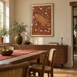 Traditional Indian Wall Art, framed on the wall of a welcoming dining room in a characterful UK home with pale warm plaster walls and stripped timber floorboards