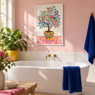 Tree of Life Wall Art, framed on the wall of a bright bathroom with a soft pink painted wall