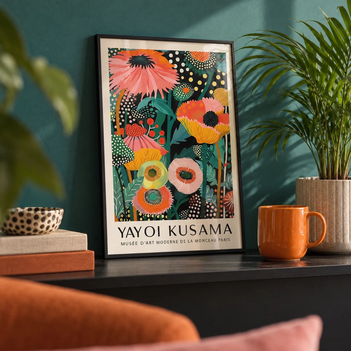 Tropical Wall Art, a small A4 framed print leaning on a black shelf in a living room