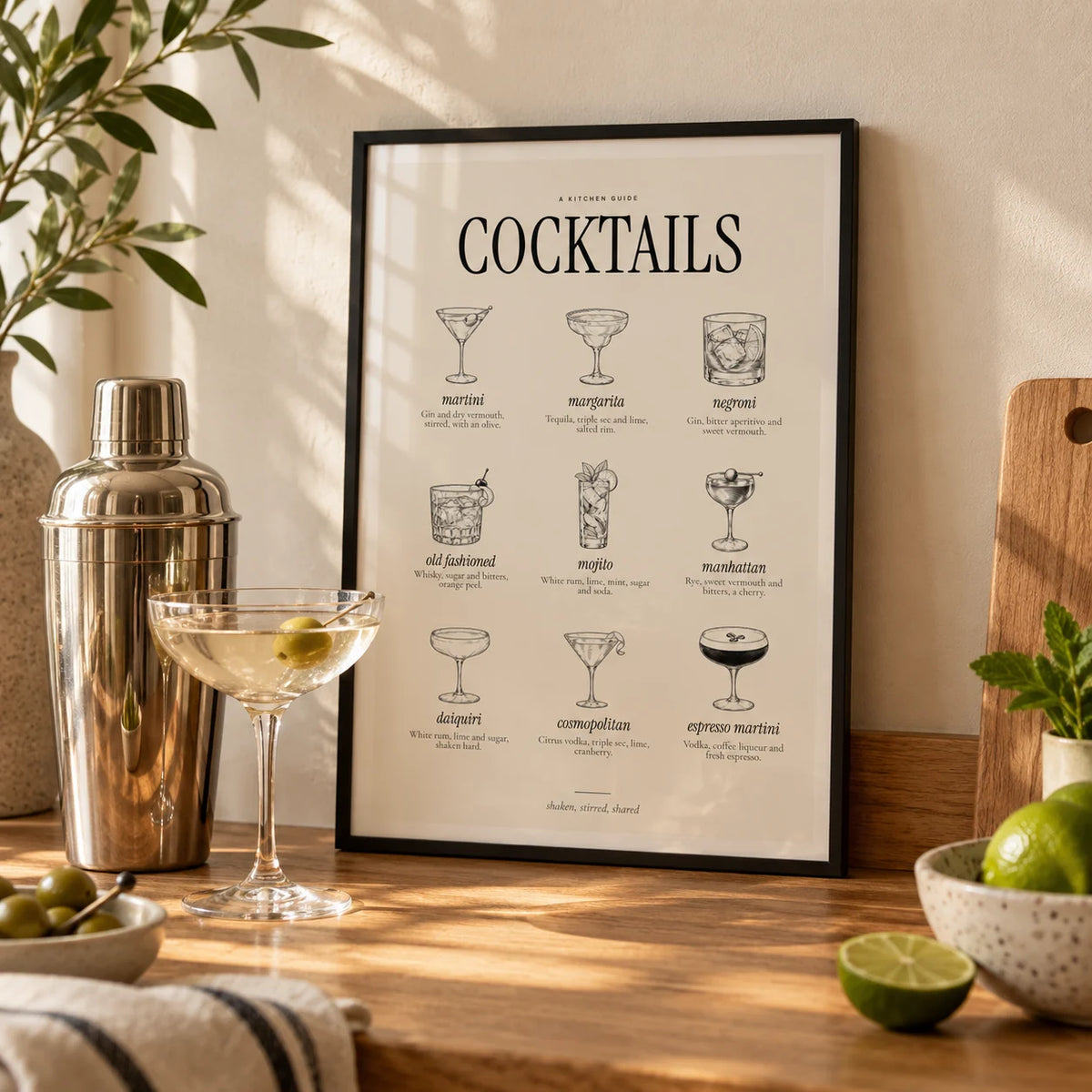 Types of Cocktails Print, a small A4 framed print leaning on an oak worktop in a kitchen